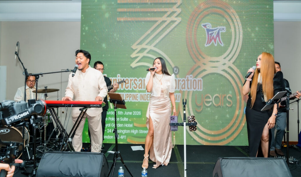 After Six Band performing live on stage at the FWA-UK Philippine National Day Gala 2026, 38th anniversary backdrop behind them